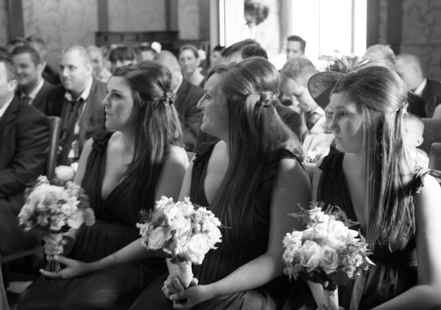 bridesmaids looking on b and w